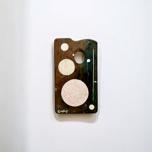 Phone case with circular cutouts on a white background